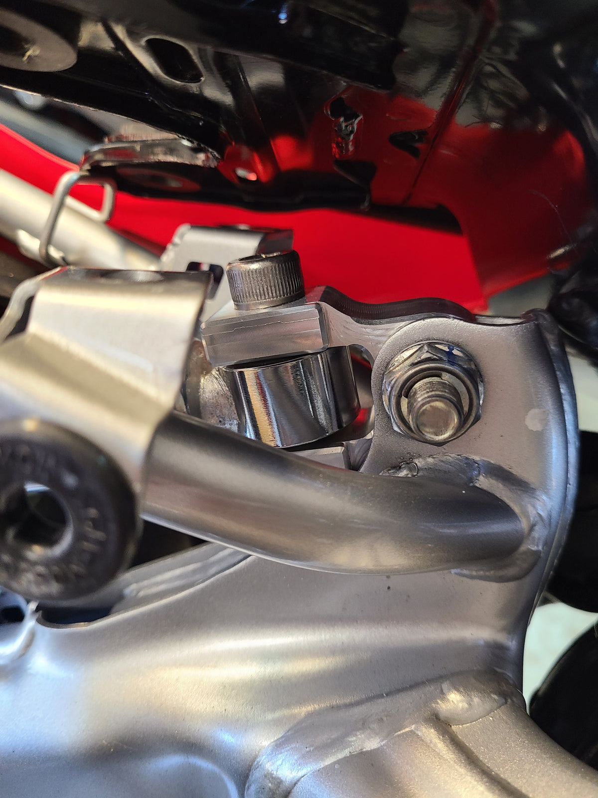 CRF110 REAR SHOCK EXTENDER